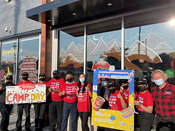 Volunteers posing for photo outside Tim Hortons Restaurant