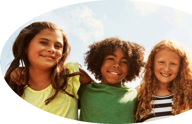 Group of three youth look at camera smiling